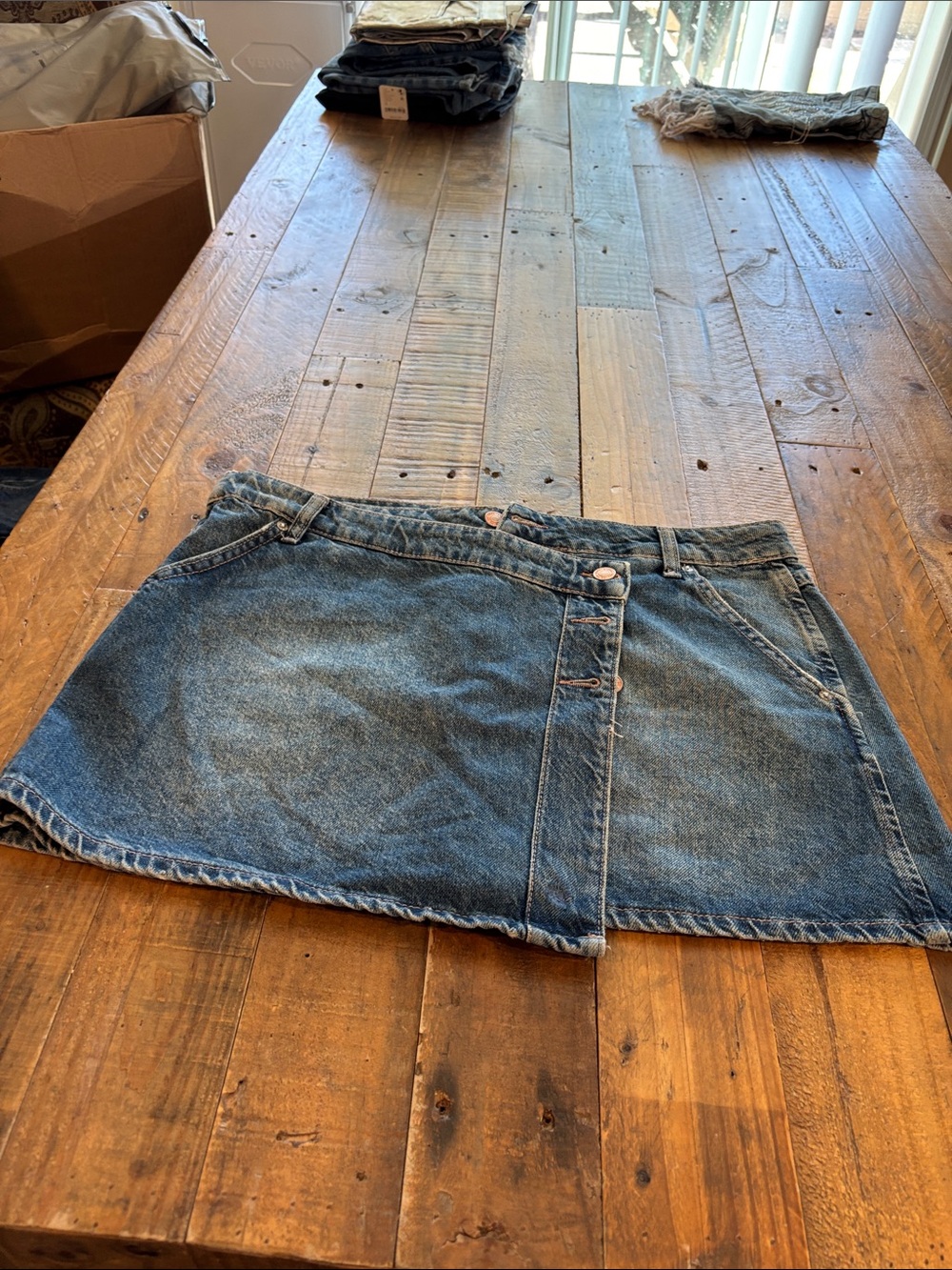 We The Free faded blue denim wrap mini skirt